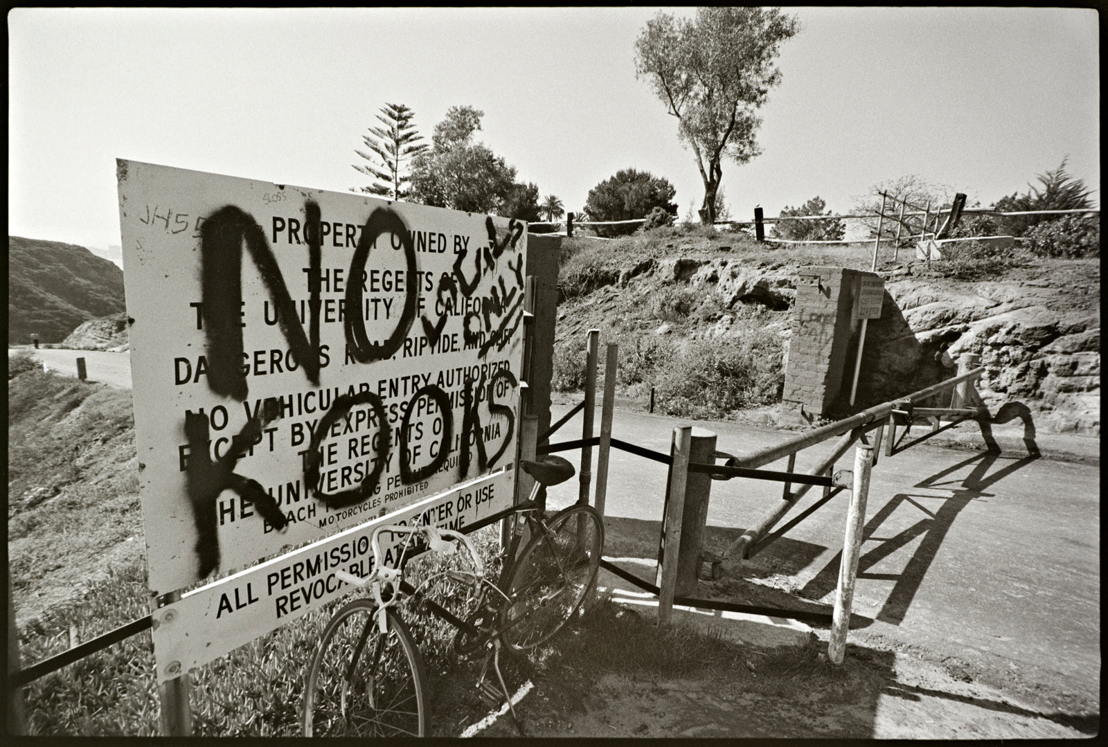 locals-only-grafitti-on-sign